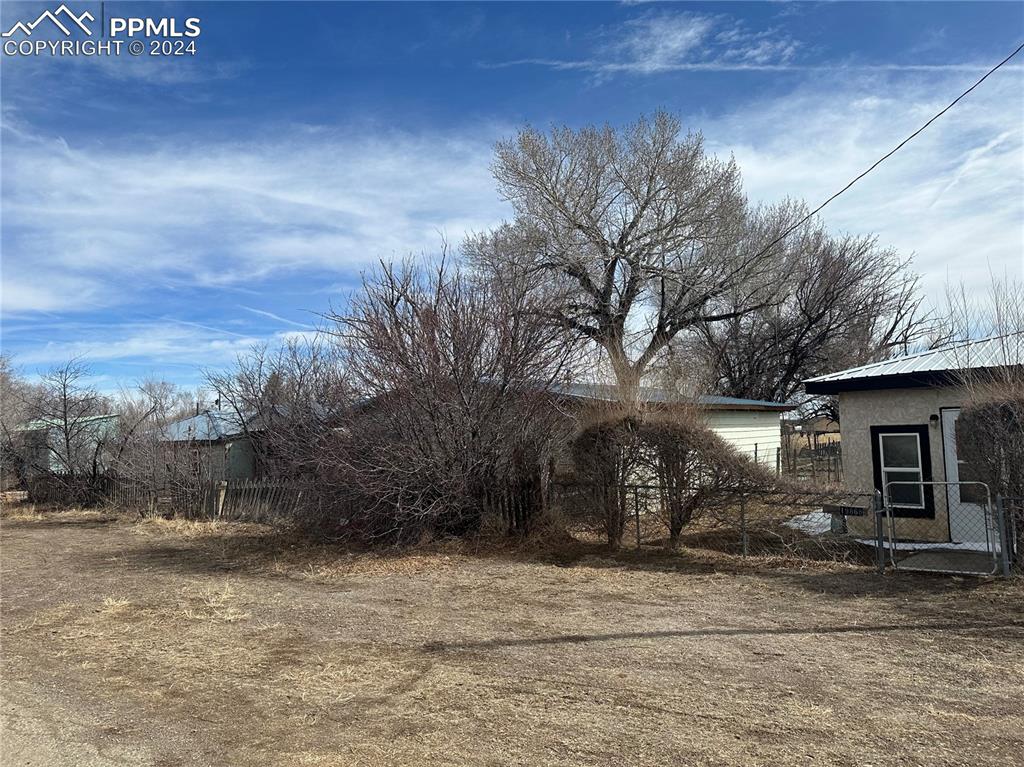 19894 County Road South Capulin, CO 81124 - Photo 6 of 9 a view of a house with a yard