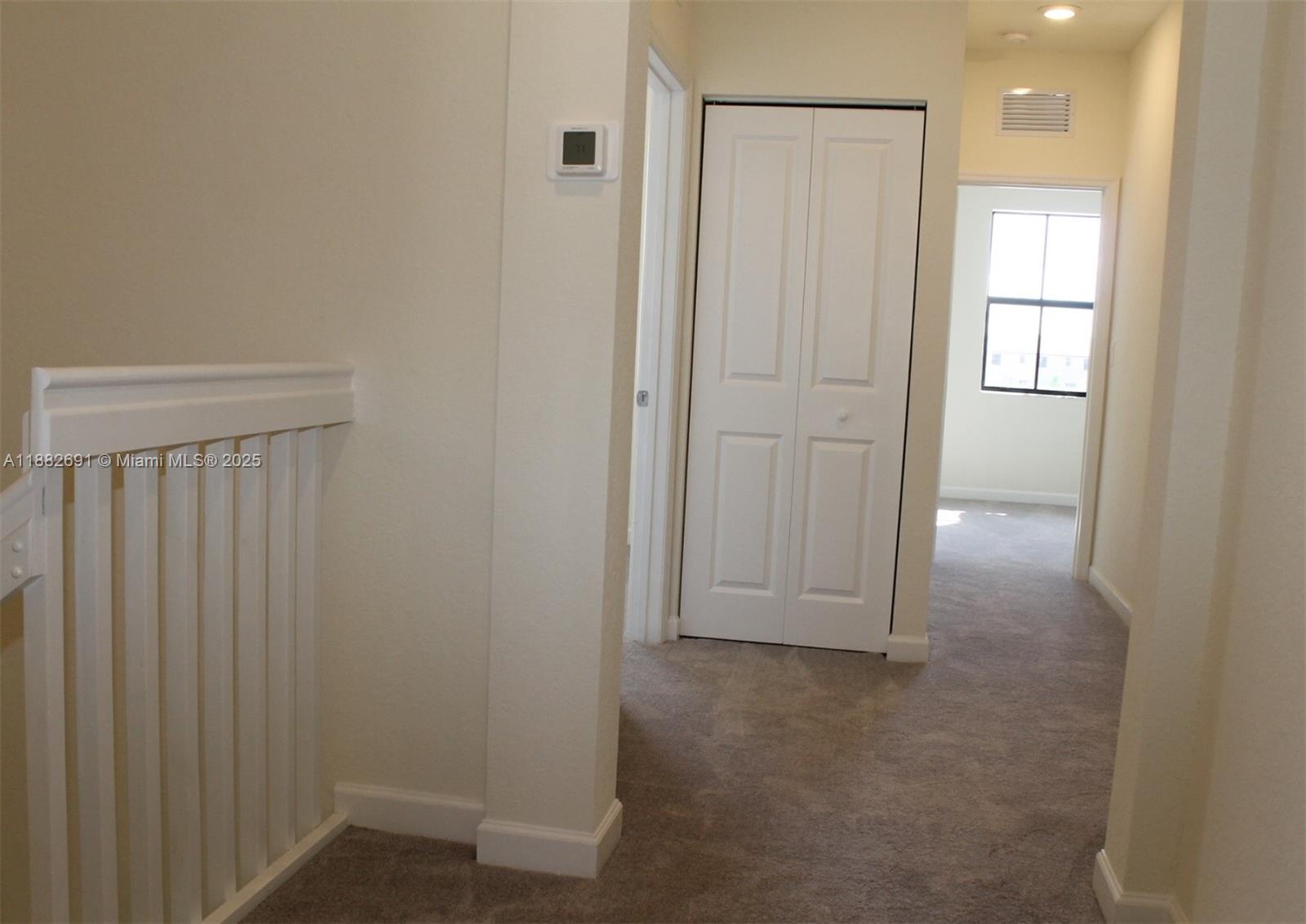 11100 West 33rd Way, Unit 11100 Hialeah, FL 33018 - Photo 13 of 26 an empty room with windows and closet