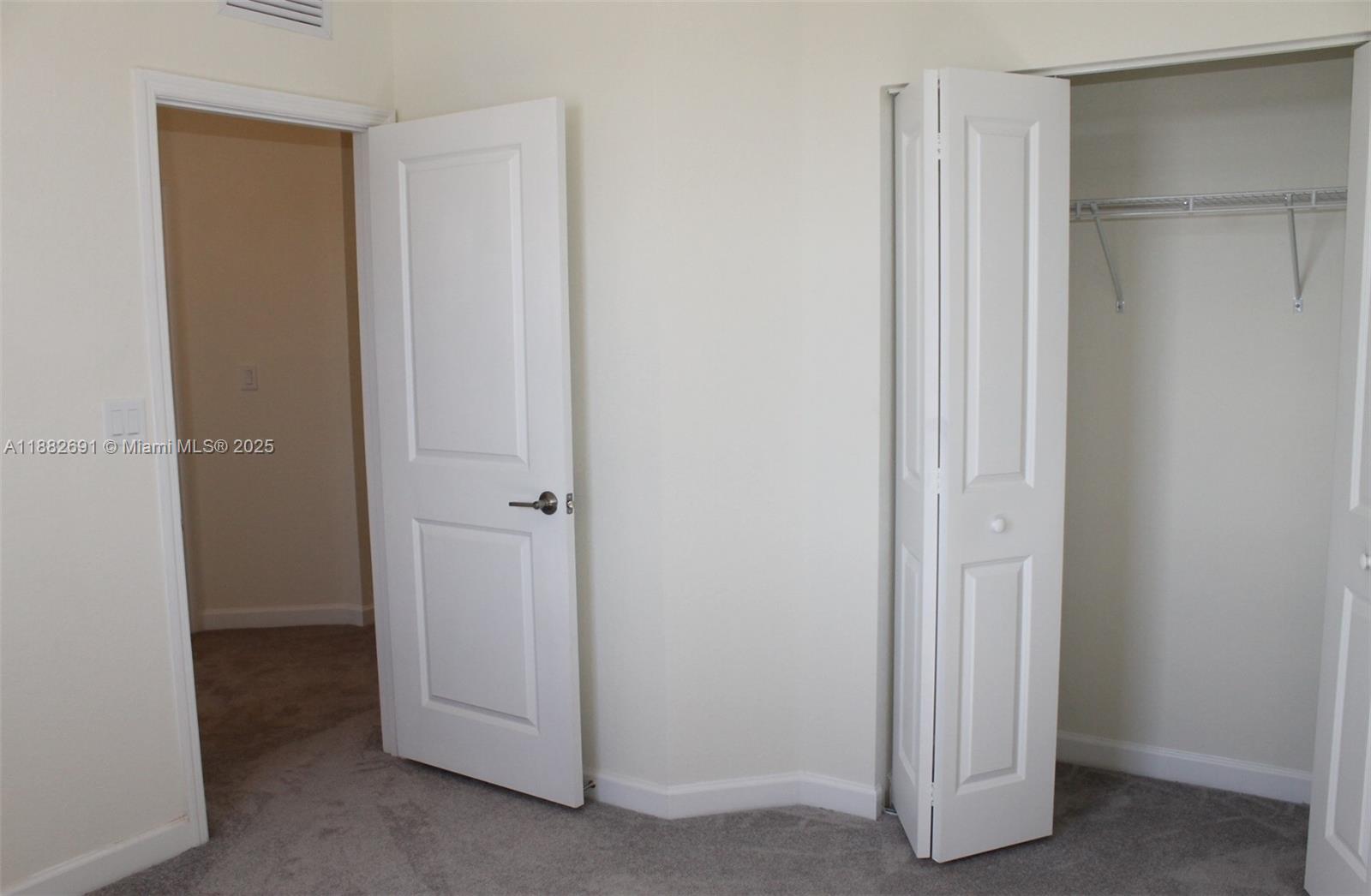 11100 West 33rd Way, Unit 11100 Hialeah, FL 33018 - Photo 14 of 26 a view of a room with closet area