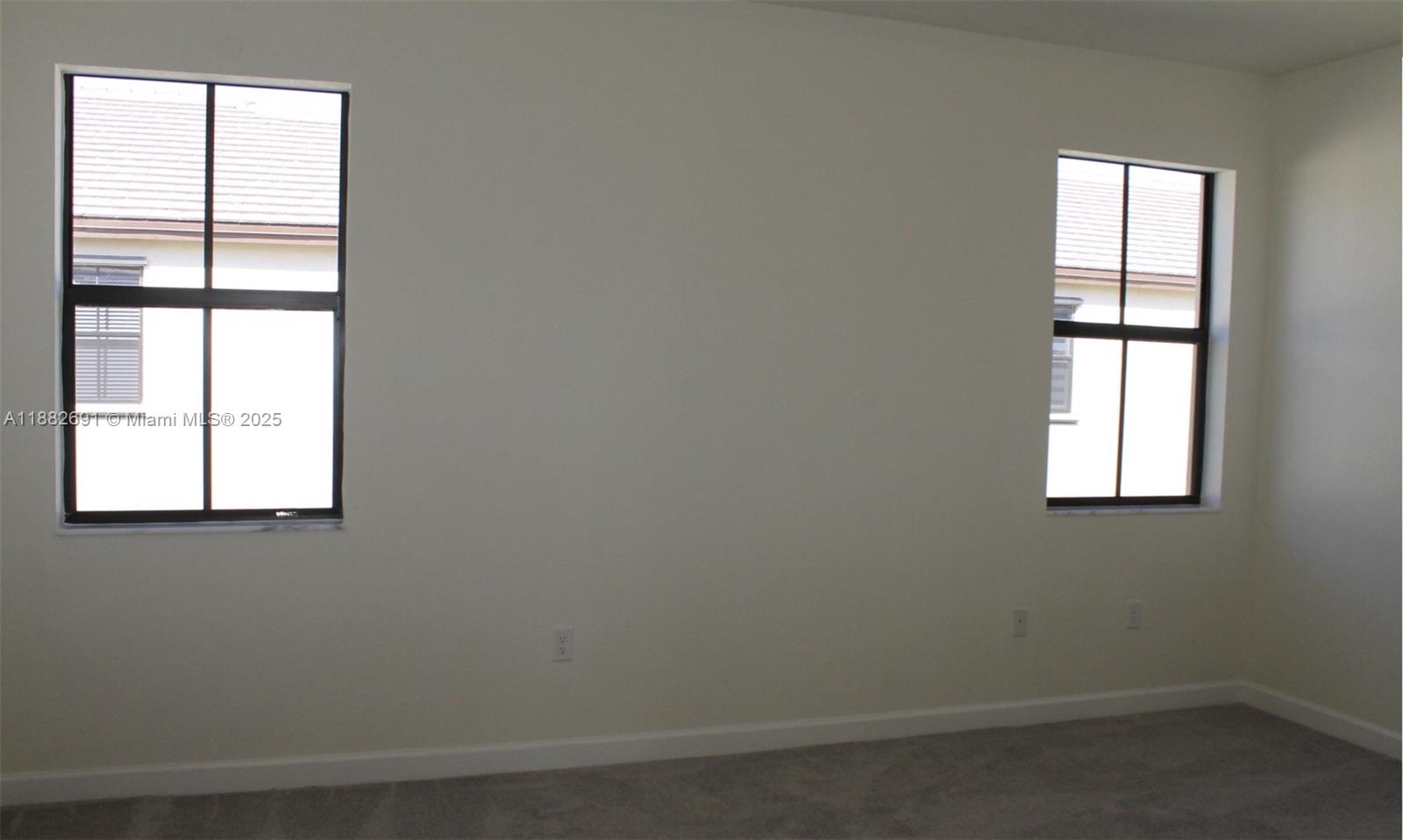 11100 West 33rd Way, Unit 11100 Hialeah, FL 33018 - Photo 18 of 26 an empty room with a window