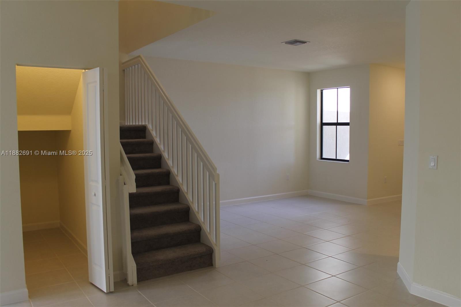 11100 West 33rd Way, Unit 11100 Hialeah, FL 33018 - Photo 2 of 26 a view of entryway and hall with wooden floor