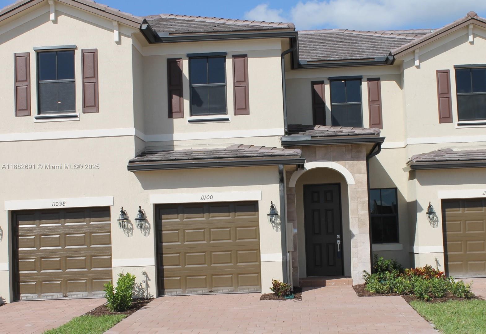 11100 West 33rd Way, Unit 11100 Hialeah, FL 33018 - Photo 22 of 26 a front view of a house