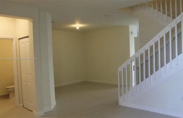 a view of a hallway with an entryway