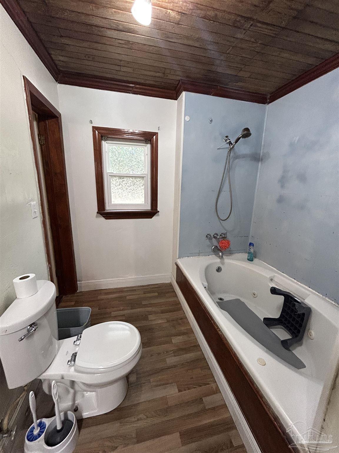 6500 Sanders Street Milton, FL 32570 - Photo 12 of 16 a bathroom with a sink a toilet and shower