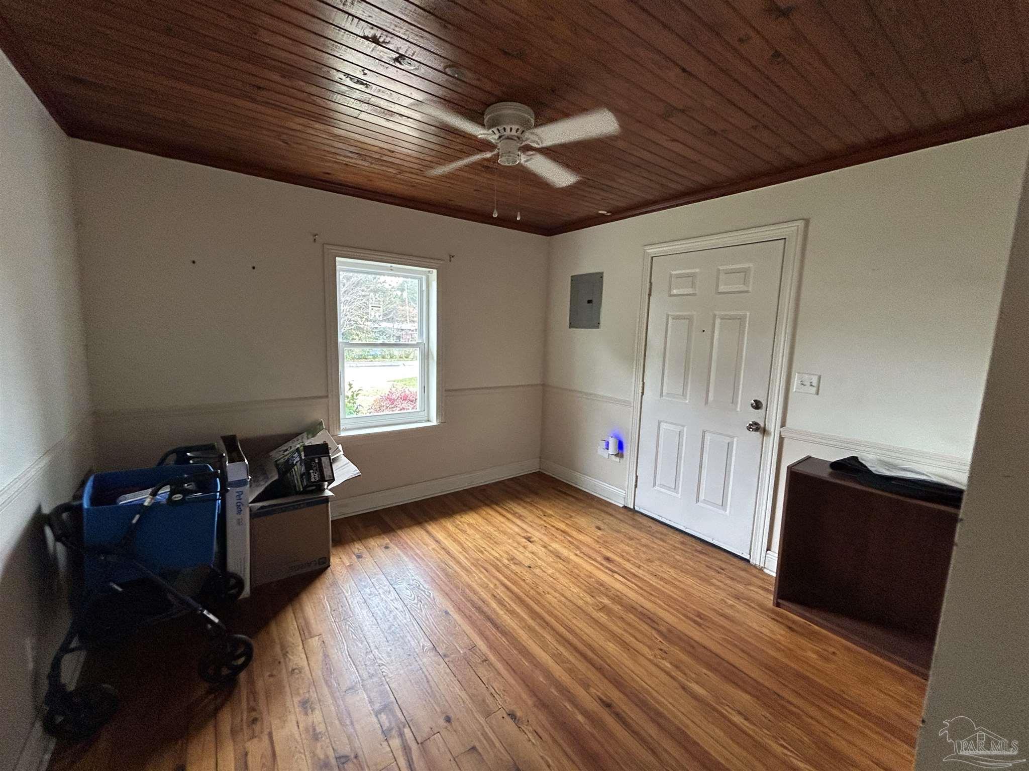 6500 Sanders Street Milton, FL 32570 - Photo 13 of 16 a living room with furniture and wooden floor