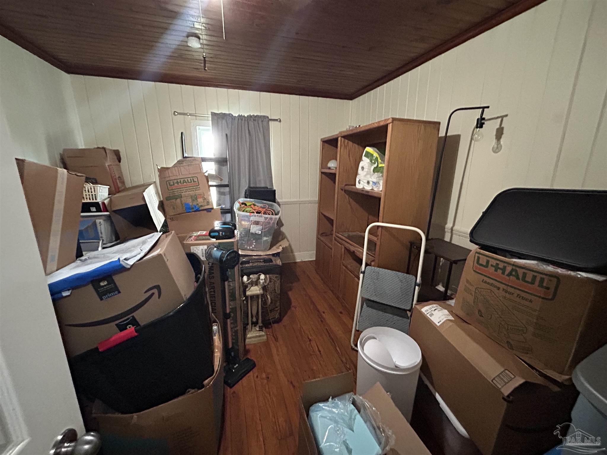 6500 Sanders Street Milton, FL 32570 - Photo 14 of 16 a living room with furniture a flat screen tv and a window