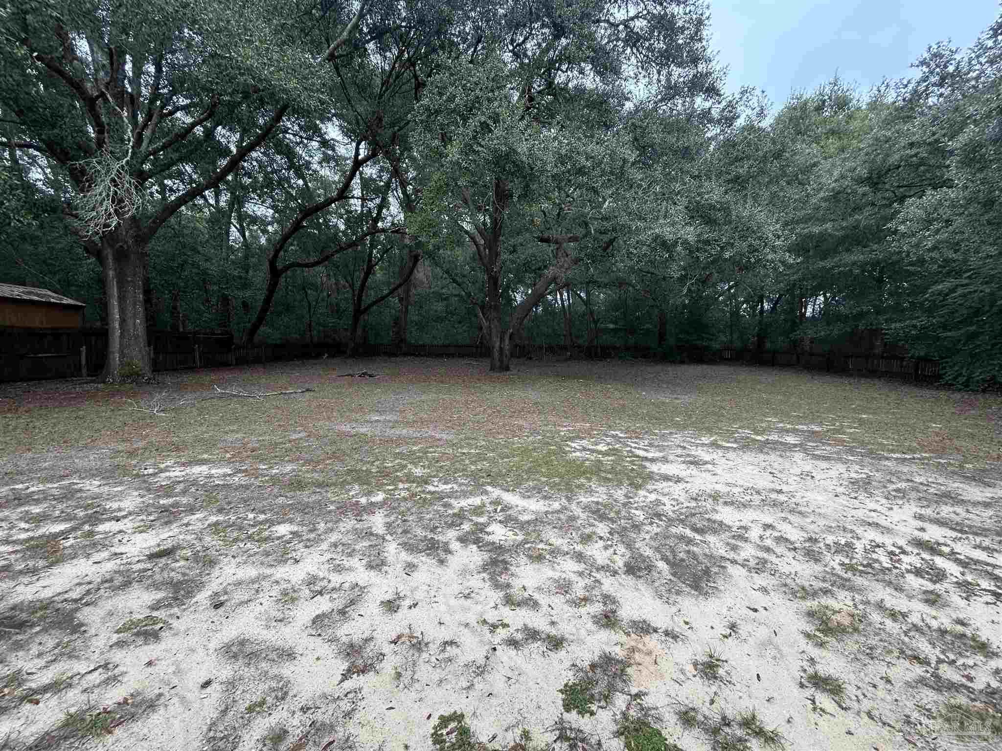 6500 Sanders Street Milton, FL 32570 - Photo 16 of 16 a view of a large tree with a yard