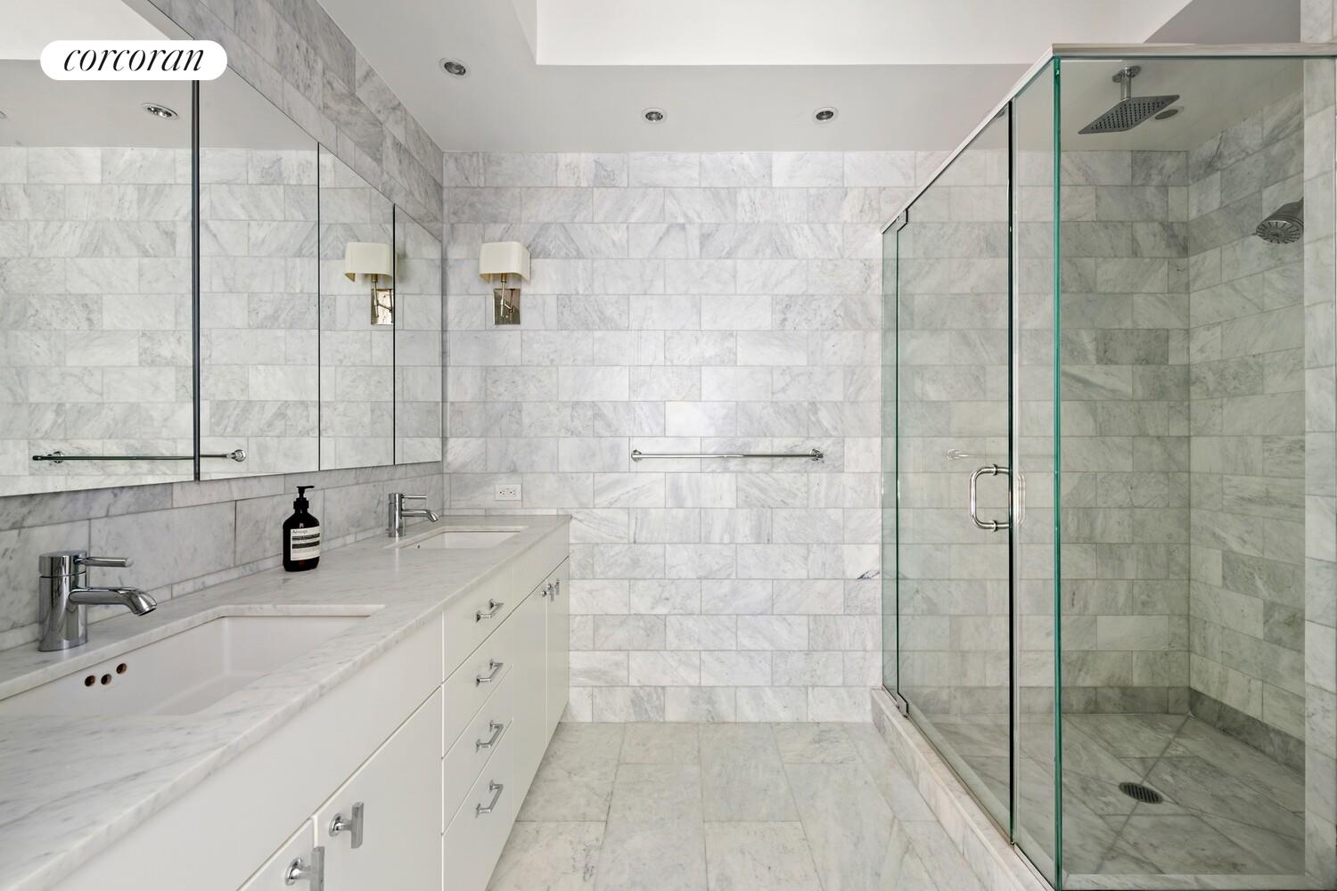 366 Broadway, Unit 4B Manhattan, NY 10013 - Photo 10 of 16 a bathroom with a double vanity sink mirror and shower