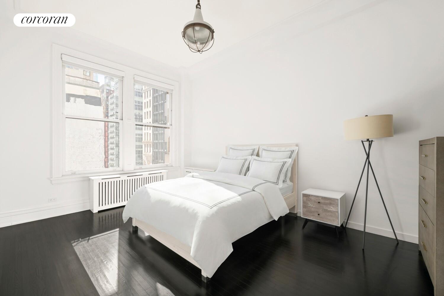 366 Broadway, Unit 4B Manhattan, NY 10013 - Photo 11 of 16 a bedroom with a bed and a large window