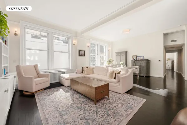 a living room with furniture and a rug