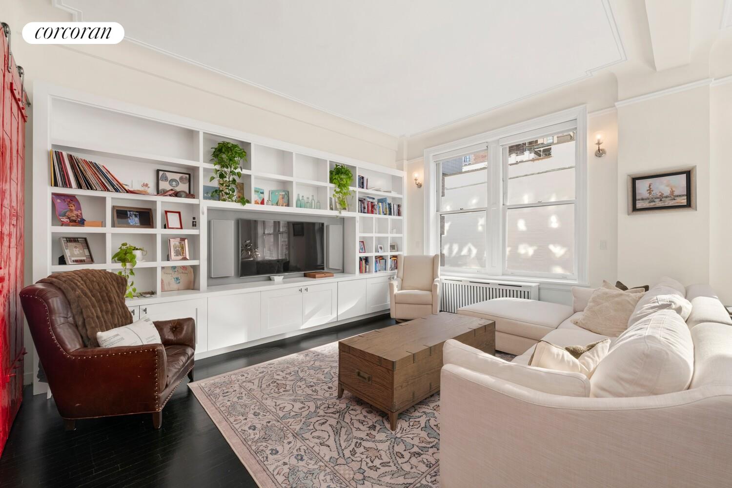 366 Broadway, Unit 4B Manhattan, NY 10013 - Photo 4 of 16 a living room with furniture and a flat screen tv