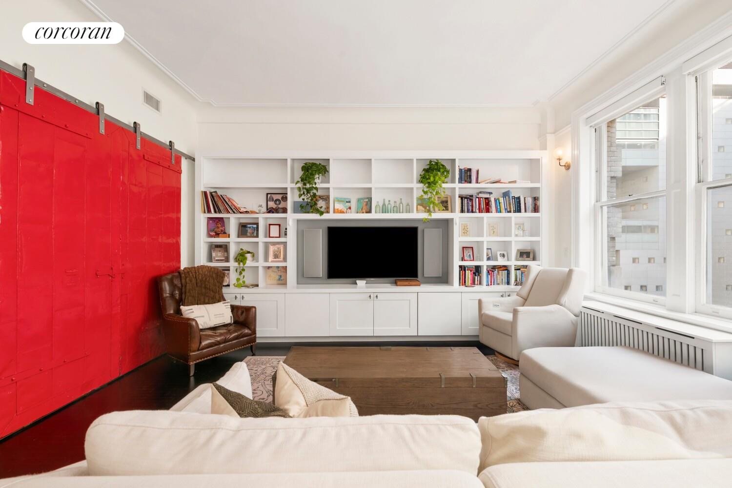 366 Broadway, Unit 4B Manhattan, NY 10013 - Photo 5 of 16 a living room with furniture and a flat screen tv