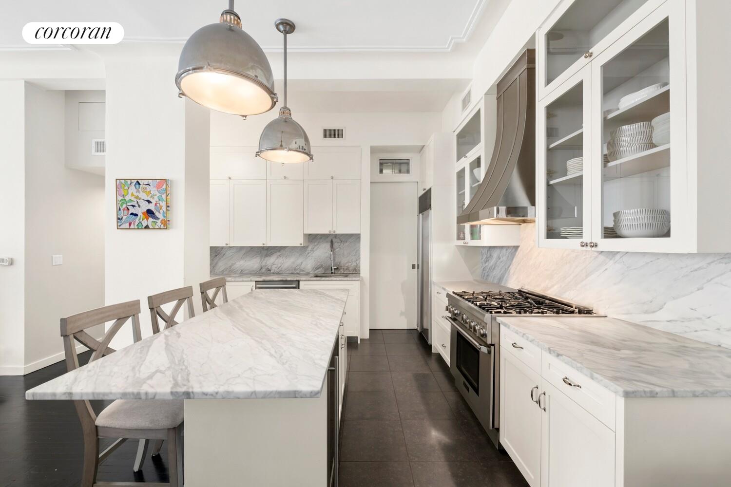 366 Broadway, Unit 4B Manhattan, NY 10013 - Photo 6 of 16 a kitchen with granite countertop a sink a stove and chairs