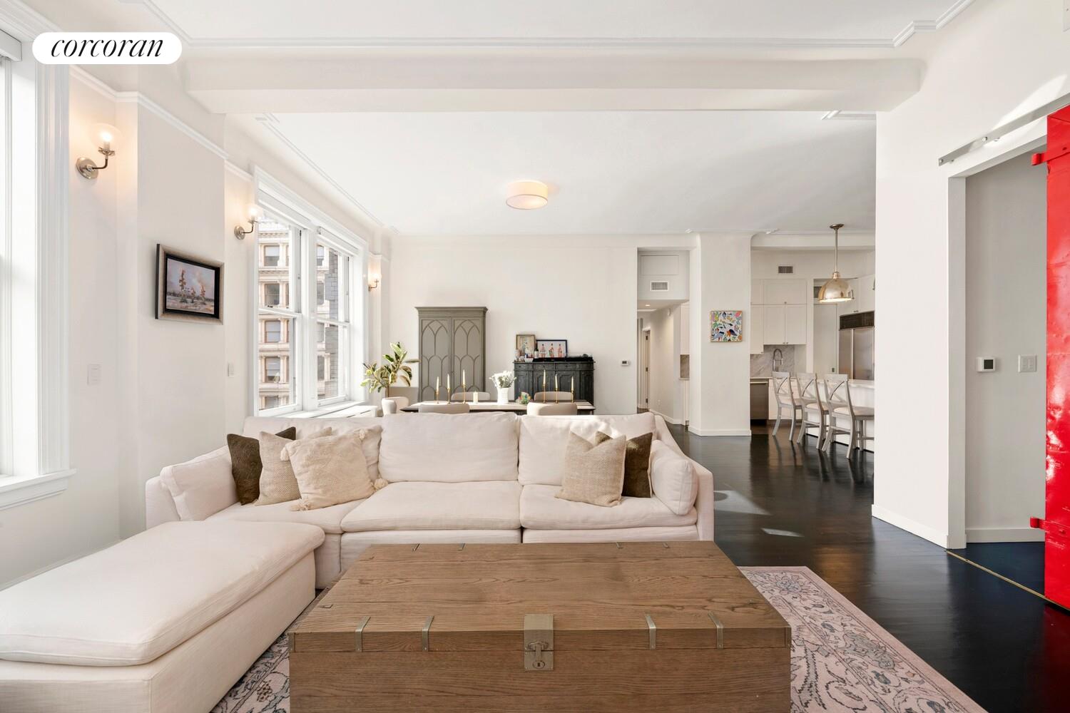 366 Broadway, Unit 4B Manhattan, NY 10013 - Photo 7 of 16 a living room with furniture and a chandelier