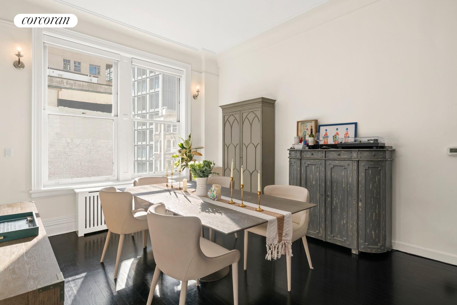 366 Broadway, Unit 4B Manhattan, NY 10013 - Photo 8 of 16 a view of a dining room with furniture window and wooden floor