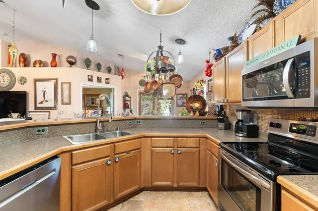 a bedroom with furniture and a chandelier