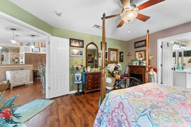 a bed room with a bed and a chandelier