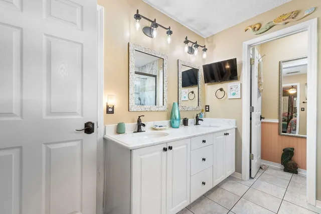a work room with furniture potted plant and book shelf