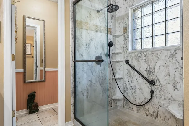 a view of a patio with table and chairs potted plants