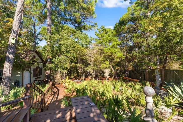 an aerial view of residential houses with outdoor space and swimming pool