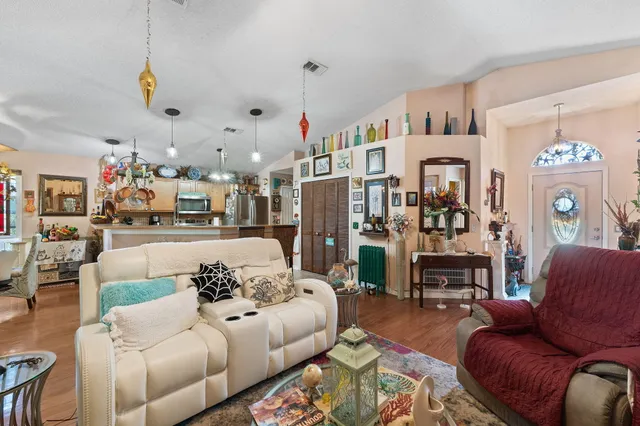 a living room with fireplace furniture and a flat screen tv