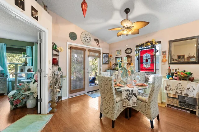 a living room filled with furniture and a wooden floor