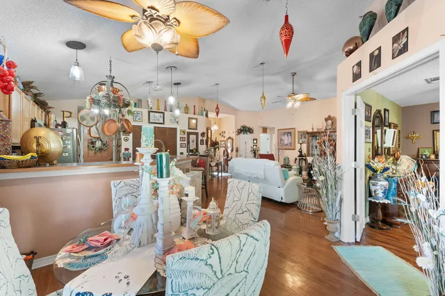 a kitchen that has a sink a stove and a microwave