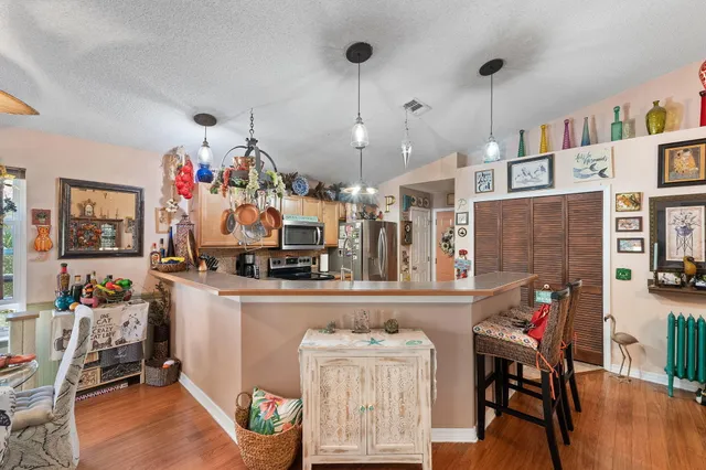 a bedroom with furniture and a wooden floor