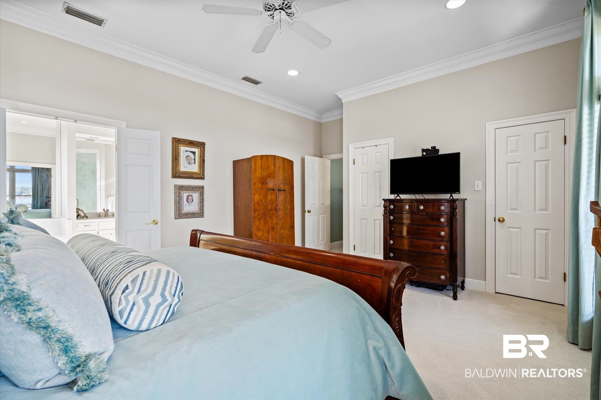4930 River Trace Theodore, AL 36582 - Photo 22 of 57 Carpeted bedroom with crown molding, ensuite bath, and ceiling fan
