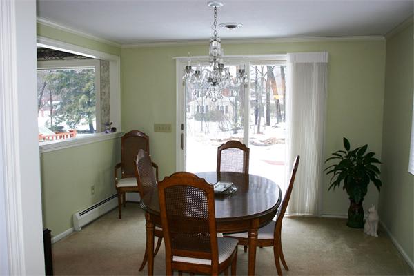 21 Blacksmith Road Wilbraham, MA 01095 - Photo 3 of 16 a dining room with furniture potted plants and chandelier