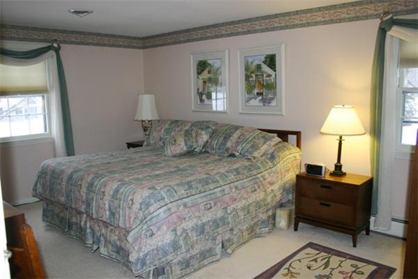 21 Blacksmith Road Wilbraham, MA 01095 - Photo 5 of 16 a bedroom with a bed and a lamp on table