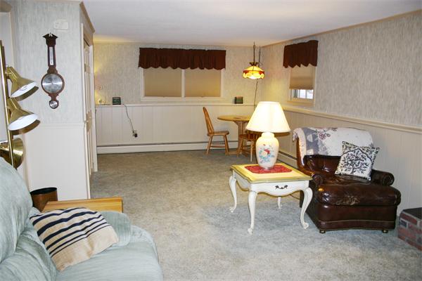 21 Blacksmith Road Wilbraham, MA 01095 - Photo 9 of 16 a living room with furniture and a chandelier