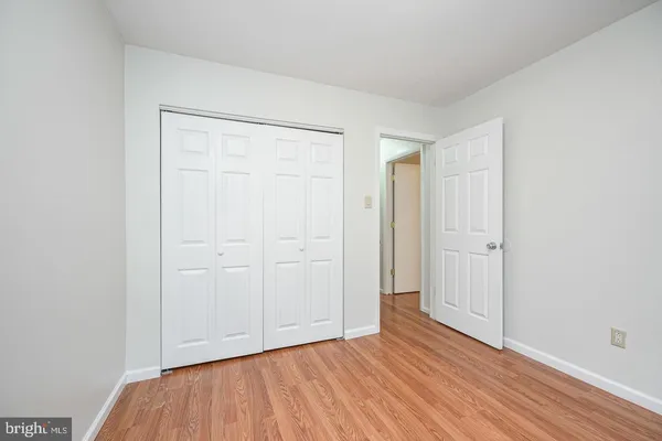 a view of an empty room and wooden floor