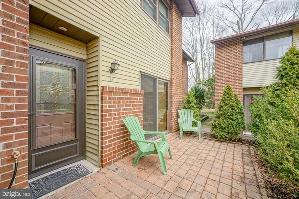 a chair and a table in front of house