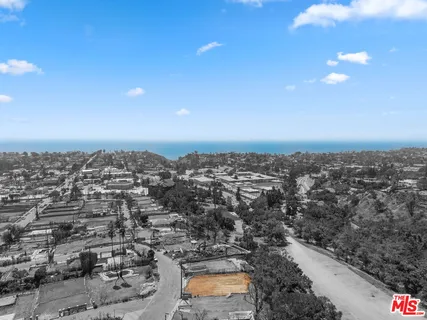 a bathroom with a granite countertop sink and a tub