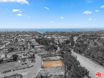 an aerial view of residential house and outdoor space