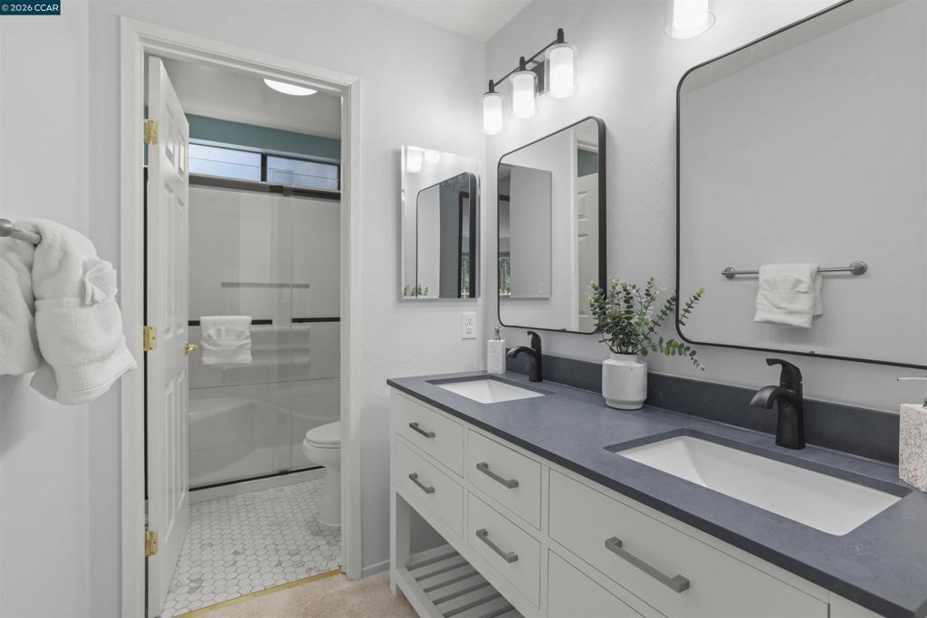 2-2 Donegal Way Martinez, CA 94553 - Photo 16 of 27 Primary bath with dual vanities tile shower