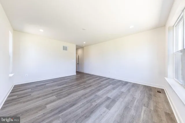 a bathroom with a granite countertop sink mirror and shower