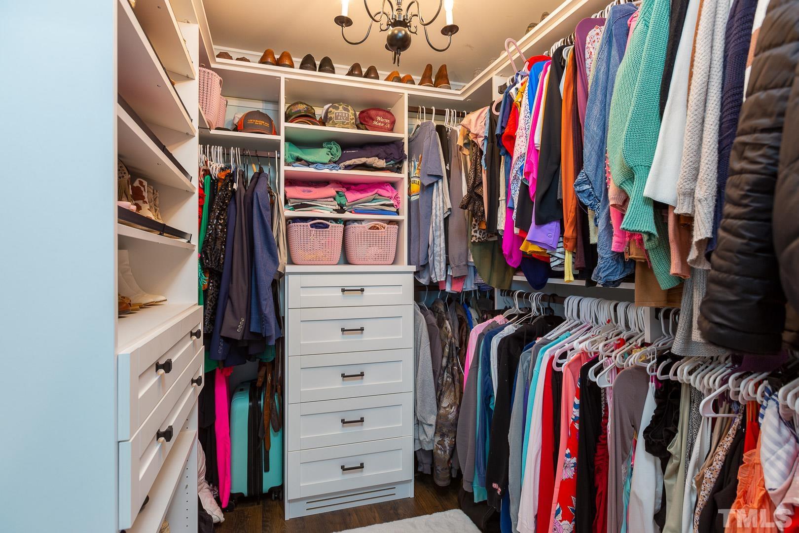 394 Jernigan Loop Road Dunn, NC 28334 - Photo 25 of 39 a view of walk in closet with clothes and shoes