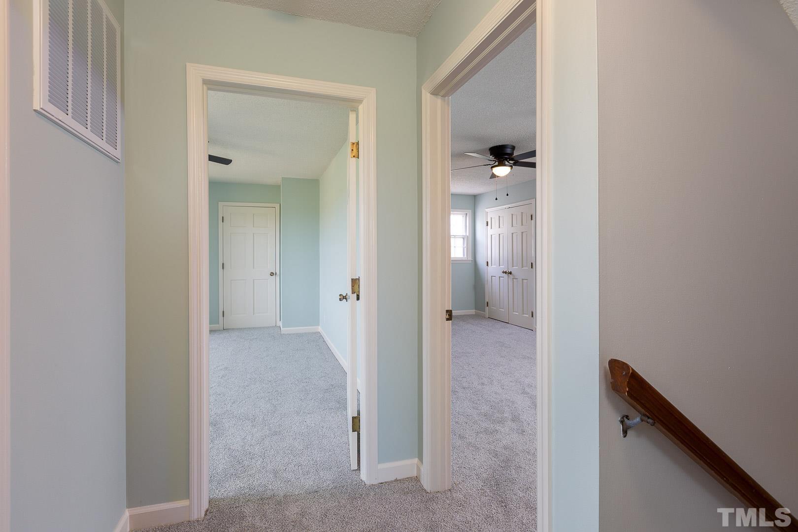 394 Jernigan Loop Road Dunn, NC 28334 - Photo 27 of 39 a view of a hallway with two rooms