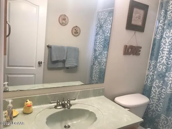 a bathroom with a sink and toilet