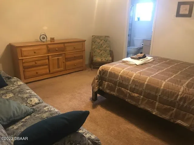 a bedroom with a bed and a cabinets
