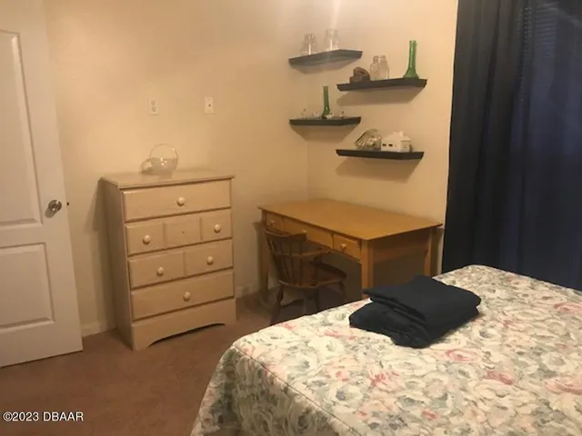 a bedroom with a bed and a cabinets