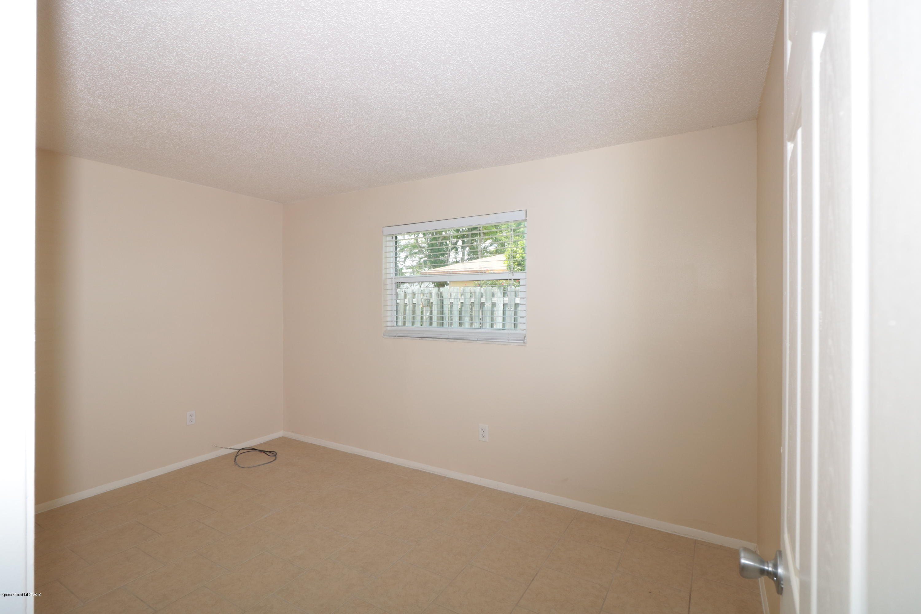 243 Ocean View Lane Melbourne, FL 32903 - Photo 16 of 18 a view of an empty room