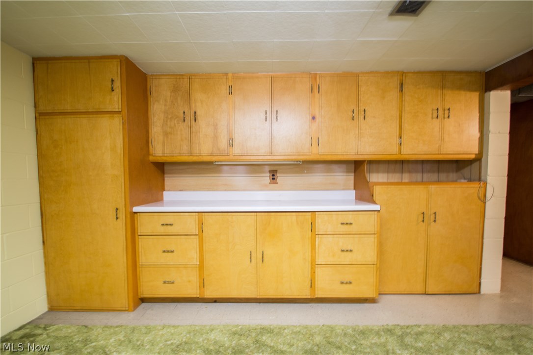 2250 Springfield Center Road Akron, OH 44312 - Photo 20 of 35 Fantastic custom built in cabinets in basement recreation room