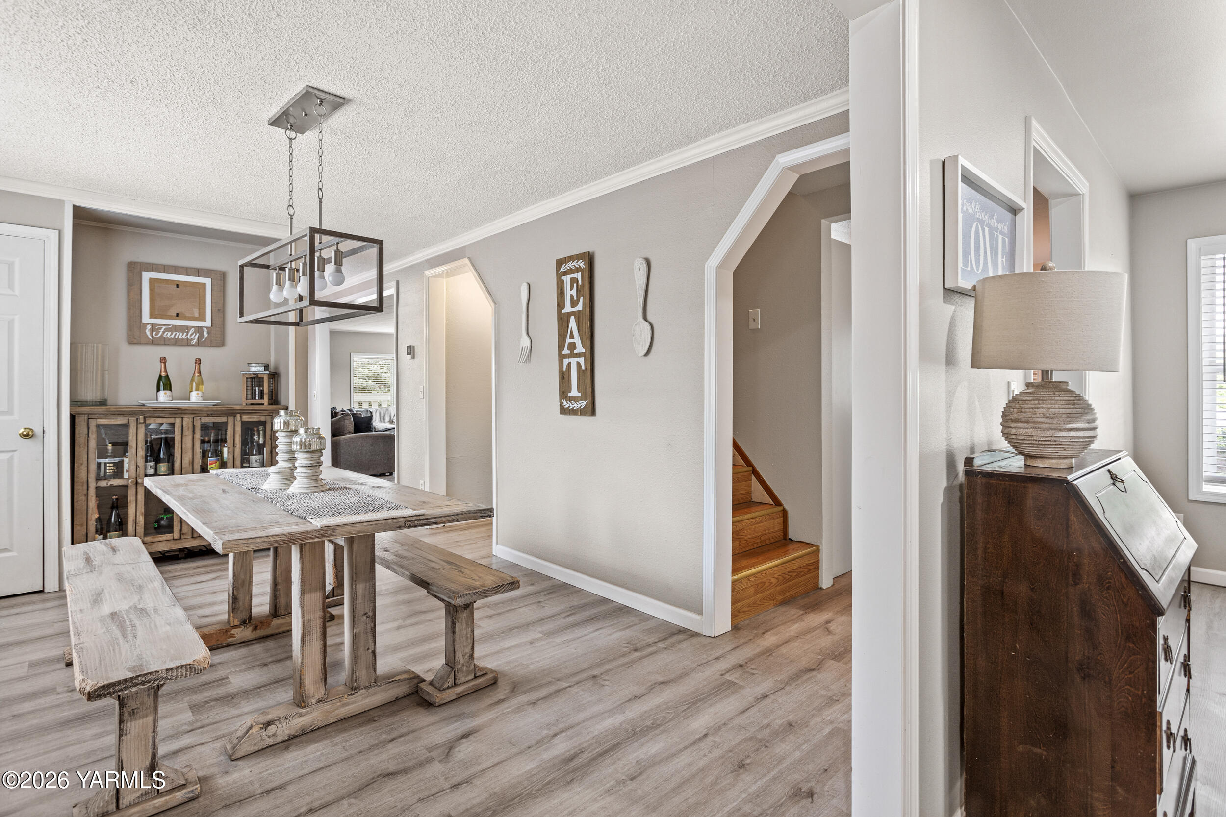 2121 Pleasant Hill Road Selah, WA 98942 - Photo 7 of 38 a dining room with wooden floor table and chairs
