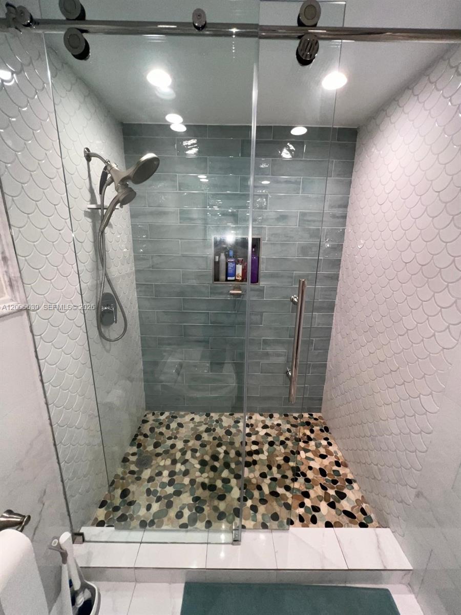 11600 Southwest 83rd Terrace Miami, FL 33173 - Photo 16 of 21 a bathroom with a shower