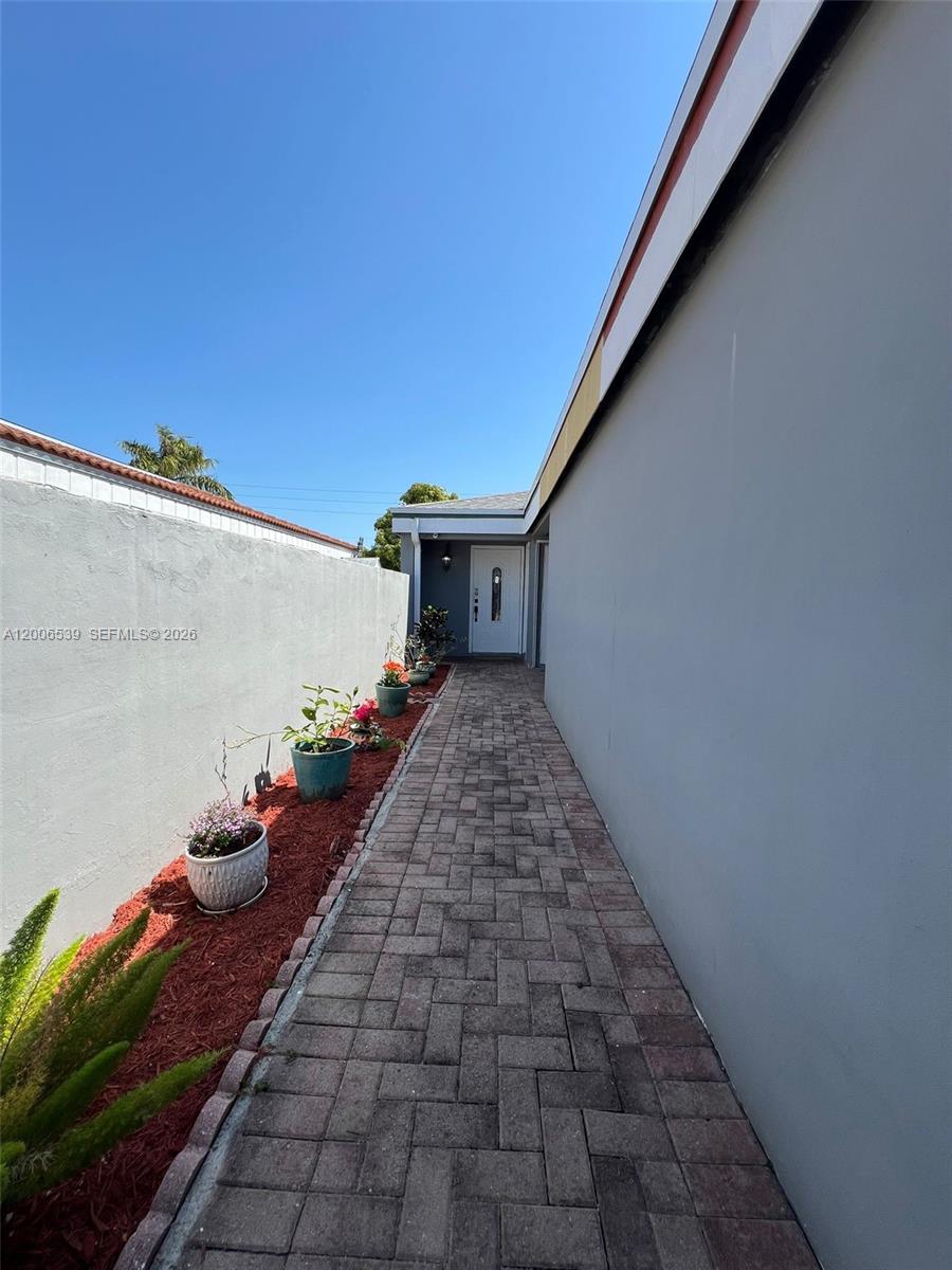 11600 Southwest 83rd Terrace Miami, FL 33173 - Photo 2 of 21 a view of a pathway with a yard
