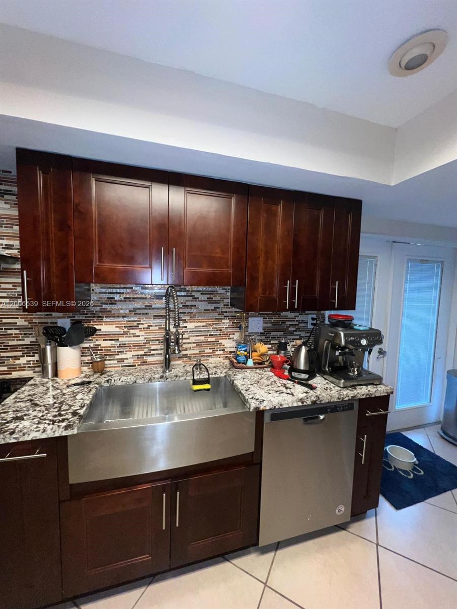 11600 Southwest 83rd Terrace Miami, FL 33173 - Photo 5 of 21 a kitchen with a sink and a stove top oven
