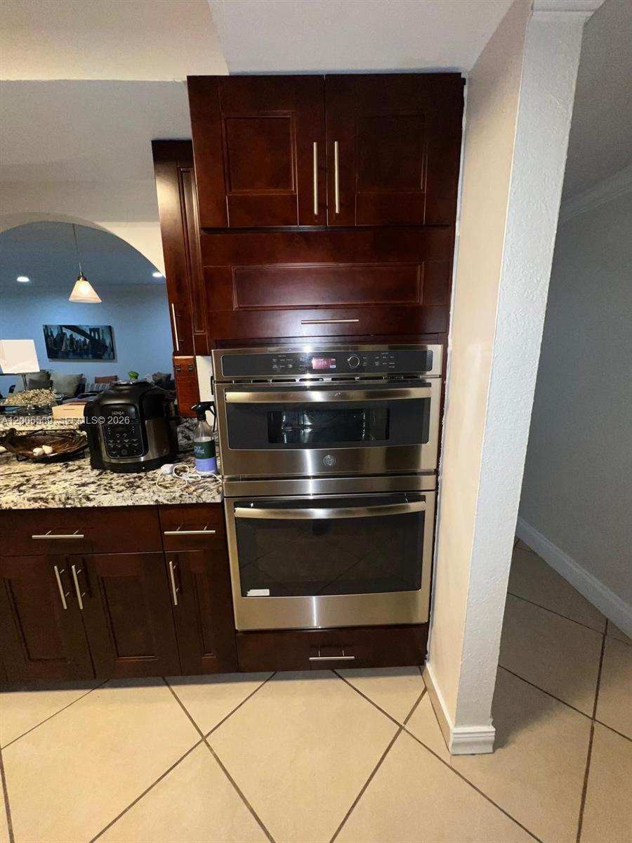 11600 Southwest 83rd Terrace Miami, FL 33173 - Photo 7 of 21 a stove top oven sitting inside of a kitchen